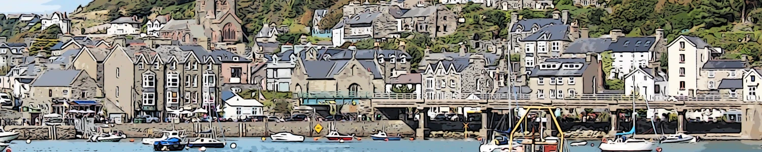 Barmouth a view across the harbour of barmouth in wales with many small craft on the water